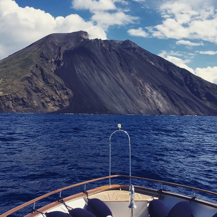 Cruising to Stromboli.  Stromboli is a small island in the #Tyrrhenian Sea, off the north coast of Sicily, containing one of the three active volcanoes in Italy. #sightseeing #volcano #eruption #lunchwithaview #blueattraction #yacht #stromboli #luxury #travel #exploring